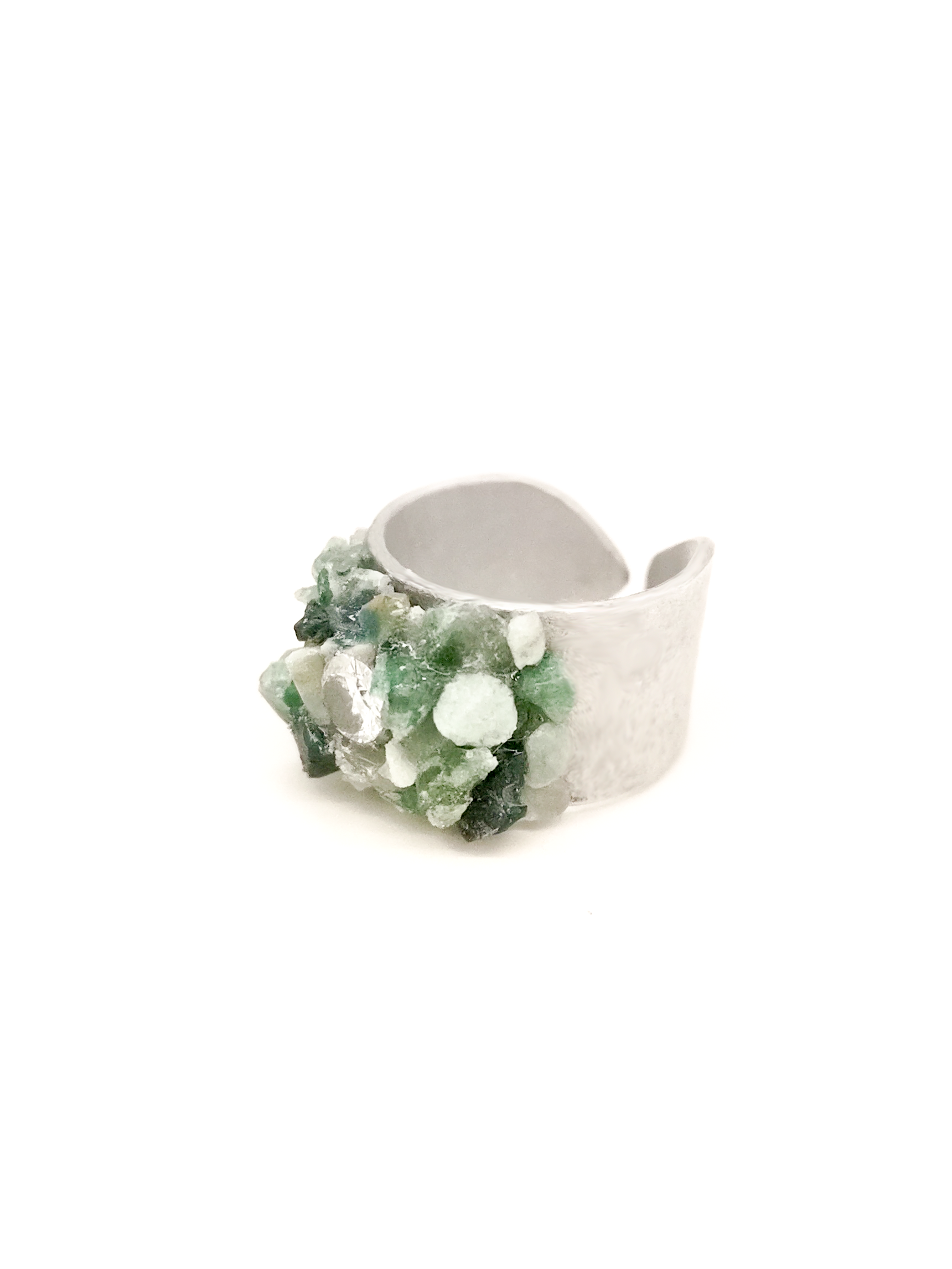 Silver ring with green gemstones on a white background
