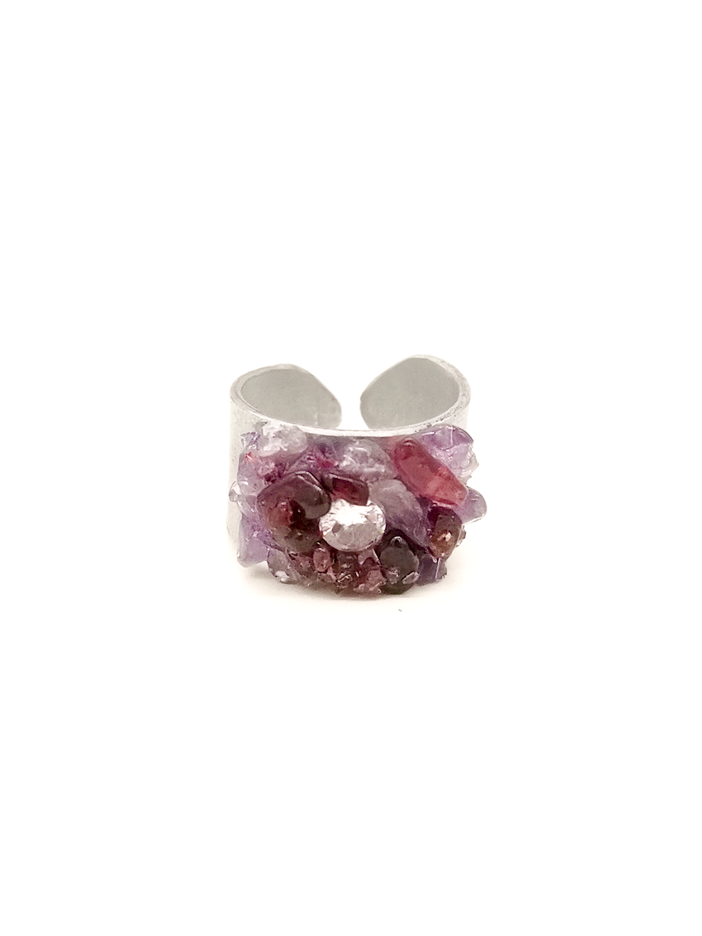 Silver ring with purple gemstone on a white background