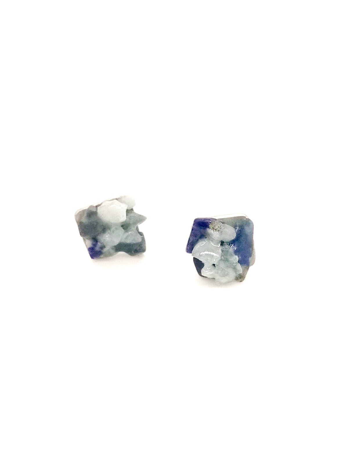 Pair of lapis lazuli stud earrings on a white background