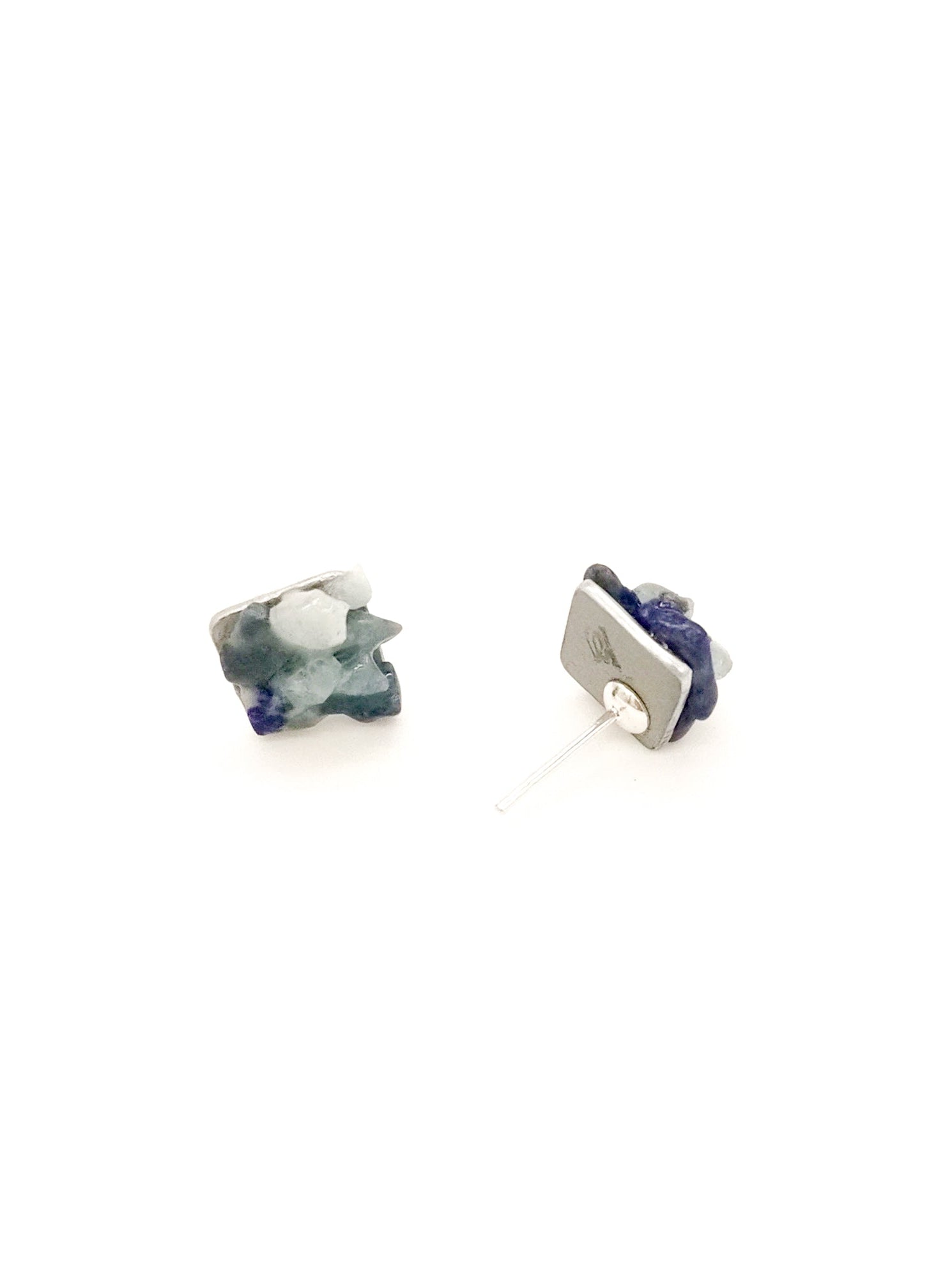 Two small studs components on a white background